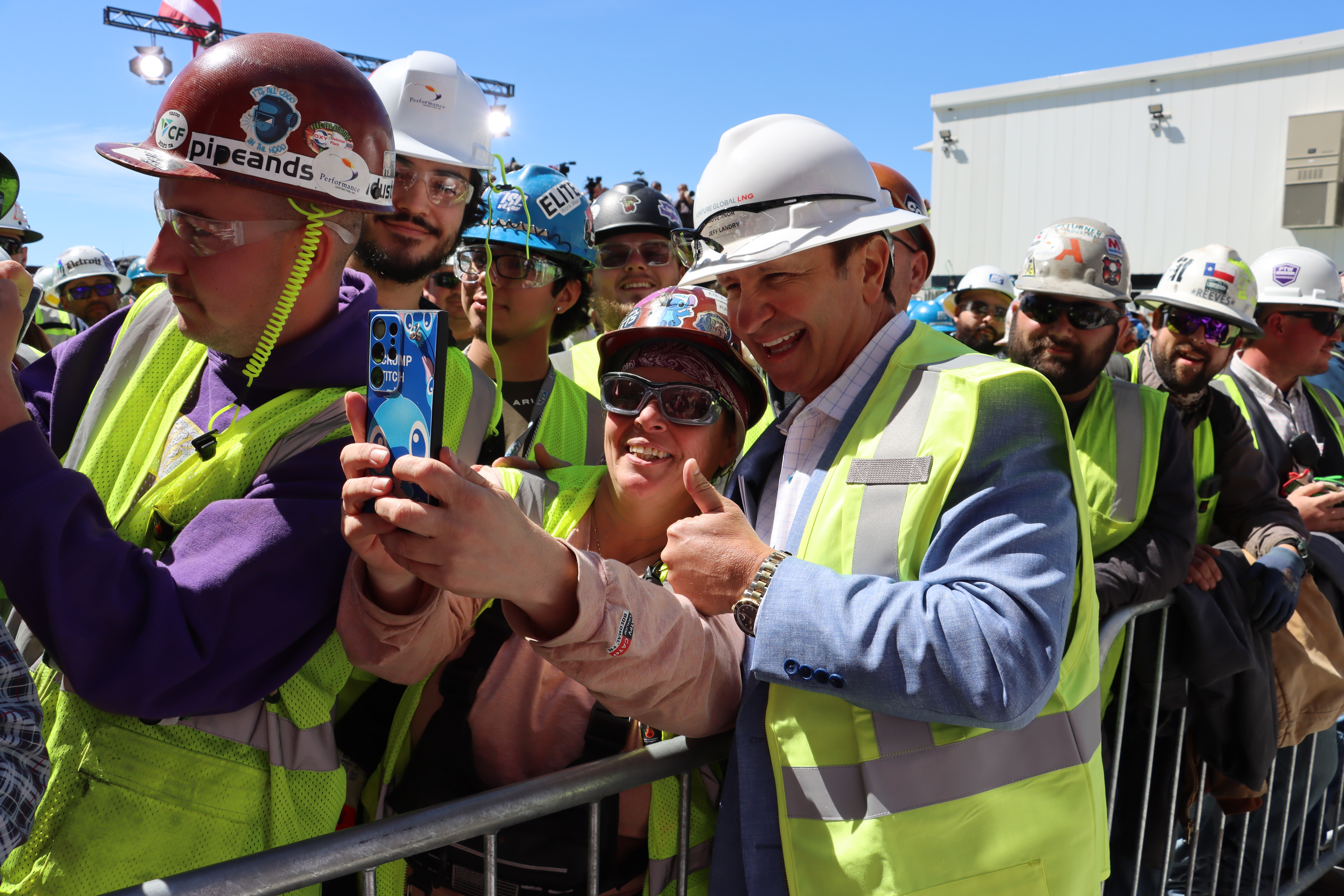 Photograph of Governor Landry taking pictures with others